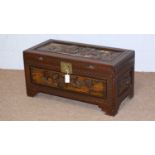 A 20th Century Asian carved camphor wood blanket box.