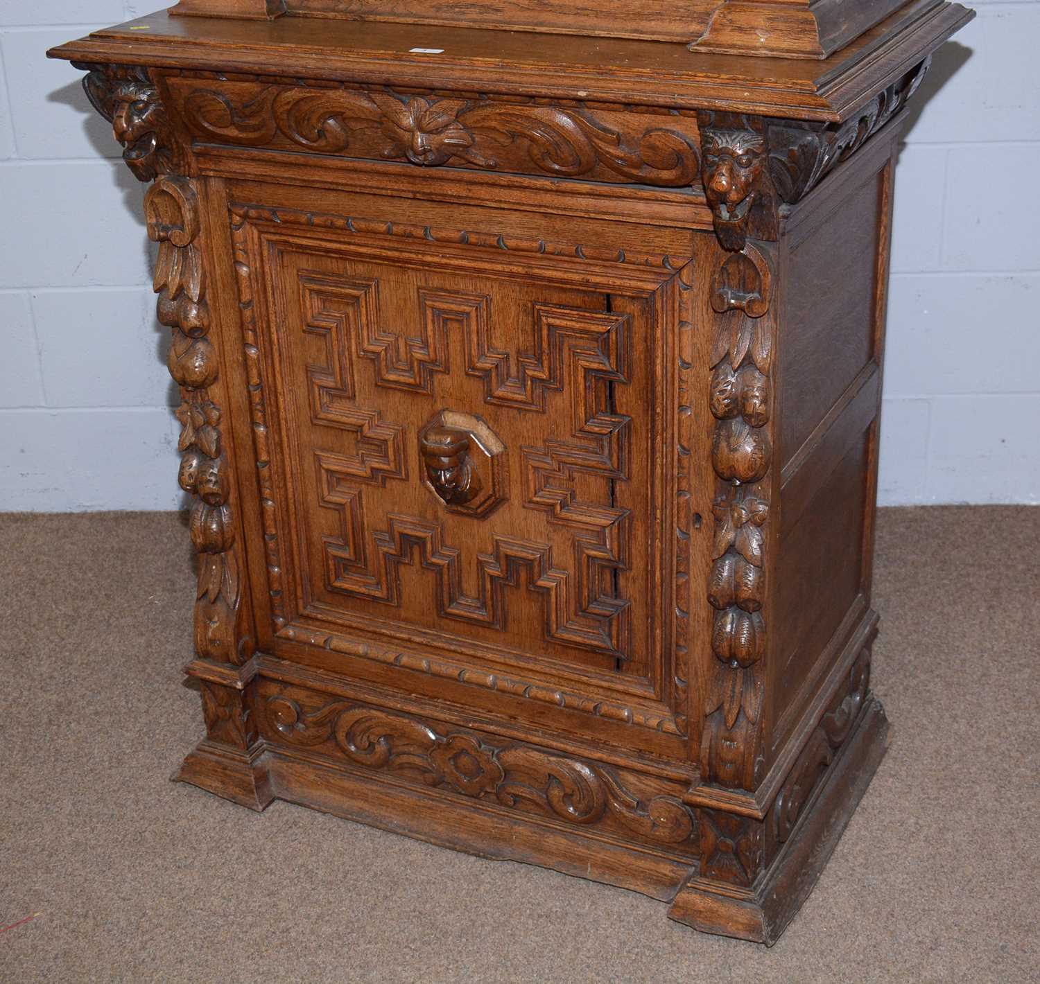 A profusely carved North European 19th C oak bookcase cabinet. - Image 12 of 12