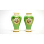 A pair of Coalport miniature vases.