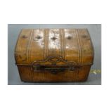 A mid 20th Century tin travel trunk