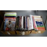 A collection of football programmes and magazines