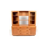 Ercol: an elm Windsor sideboard and display cabinet.