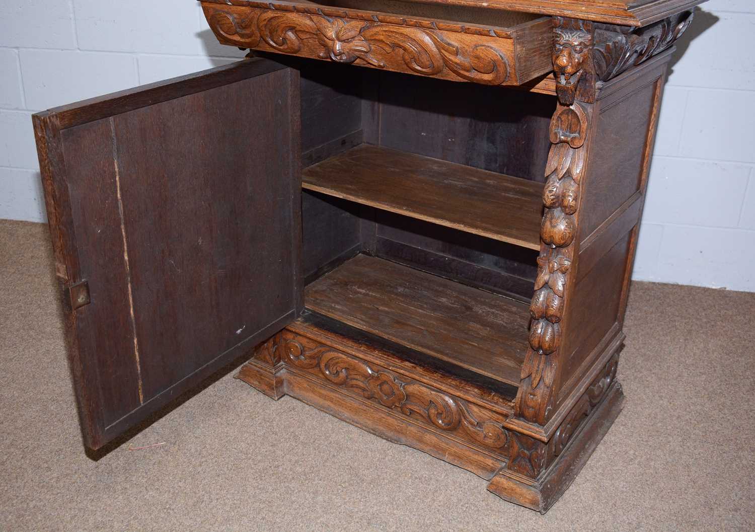 A profusely carved North European 19th C oak bookcase cabinet. - Image 6 of 12