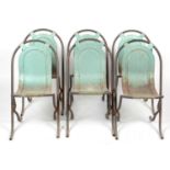 Six mid Century tubular and shaped metal industrial-style chairs.