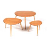 Ercol: a nest of three model 354 'Pebble' occasional tables