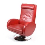 A contemporary red leather swivel reclining armchair