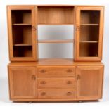 Ercol: an elm Windsor sideboard and display cabinet.