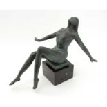 Milo: a modernist patinated bronze sculpture of a reclining female nude.