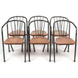 Six mid Century tubular and shaped metal industrial chairs.