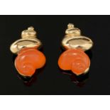 Christian Dior: a pair of gilt-metal and orange plastic shell pattern clip earrings,