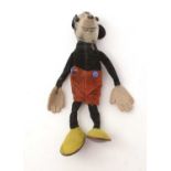 A Walt Disney Productions Mickey Mouse felt soft toy.