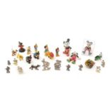 A selection of Walt Disney figurines; and other related items.