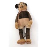 A Walt Disney Productions Mickey Mouse felt soft toy.