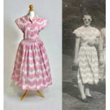 A late 1940s Horrockses printed cotton day dress | in a stylised scalloped lace pattern on pink