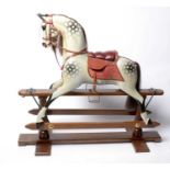 Stevenson Brothers: a fine painted wooden rocking horse,