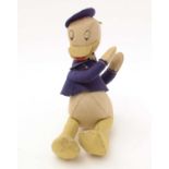 A mid 20th Century Walt Disney Donald Duck felt soft toy.