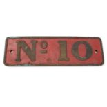 A cast bronze and red painted engine plate