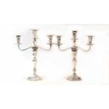A pair of Victorian silver two-branch three-light candelabra