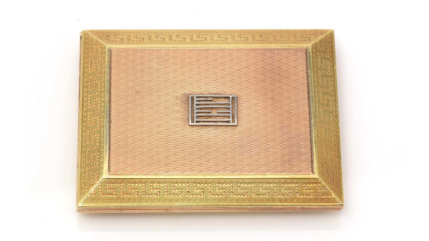 An Art Deco 9ct three-coloured gold matchbook case,