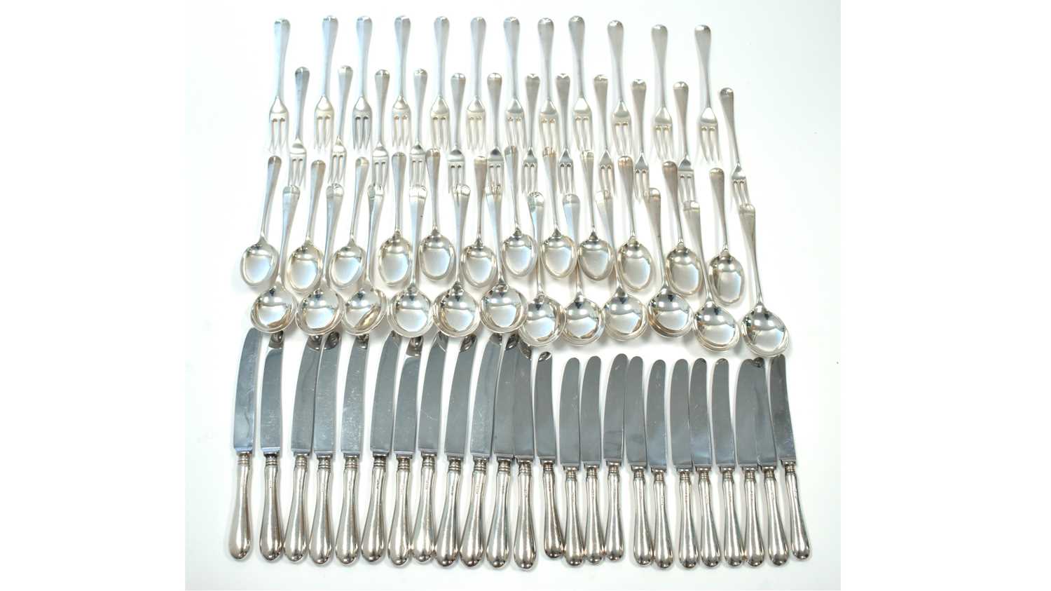 A composite suite of silver cutlery for twelve places,
