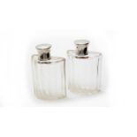 A pair of French 950 standard silver mounted cut glass decanters,