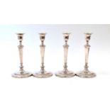 A set of four George V silver candlesticks, by Crichton Brothers