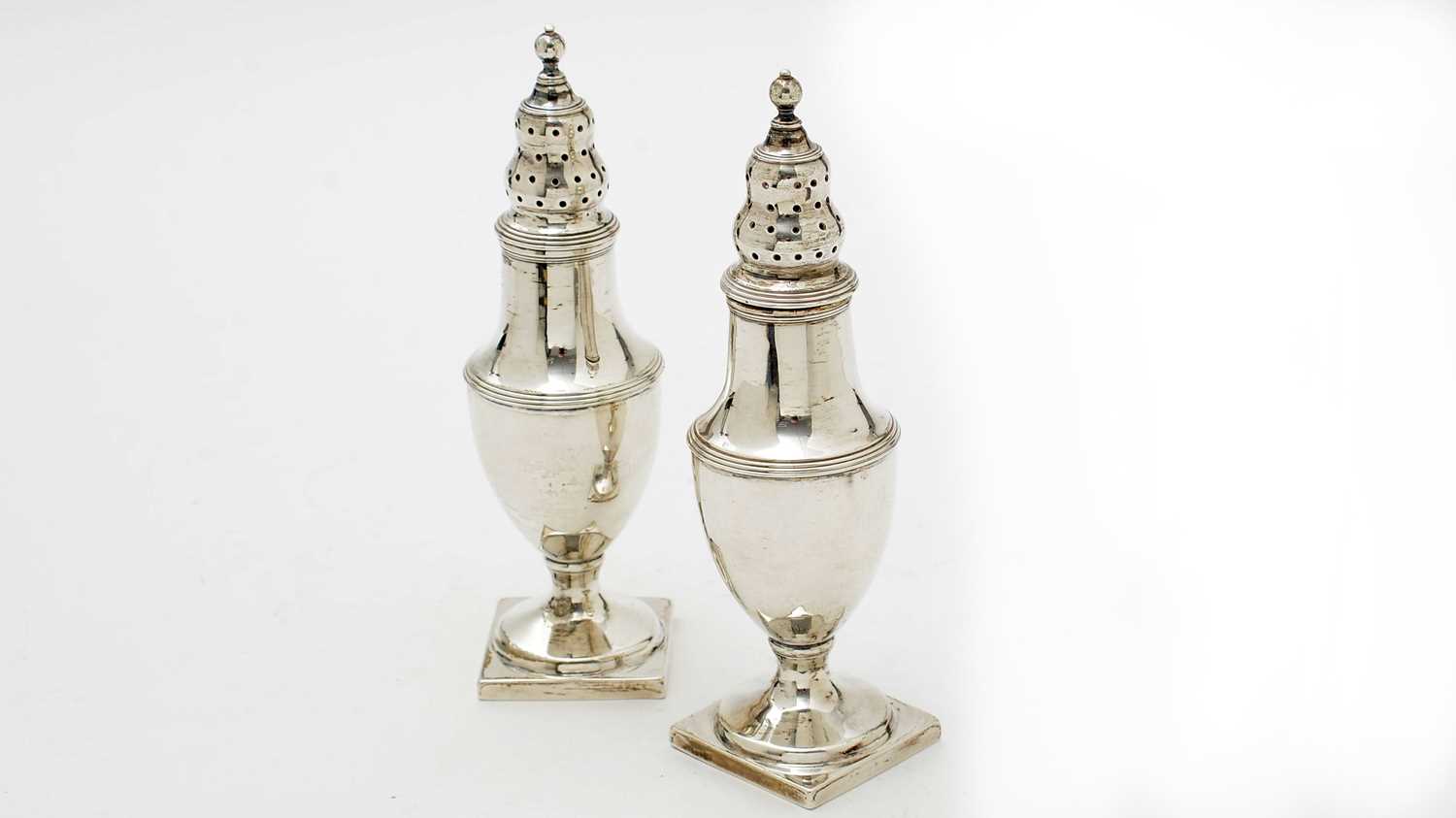 A pair of George III silver pepperettes, by James Mince,