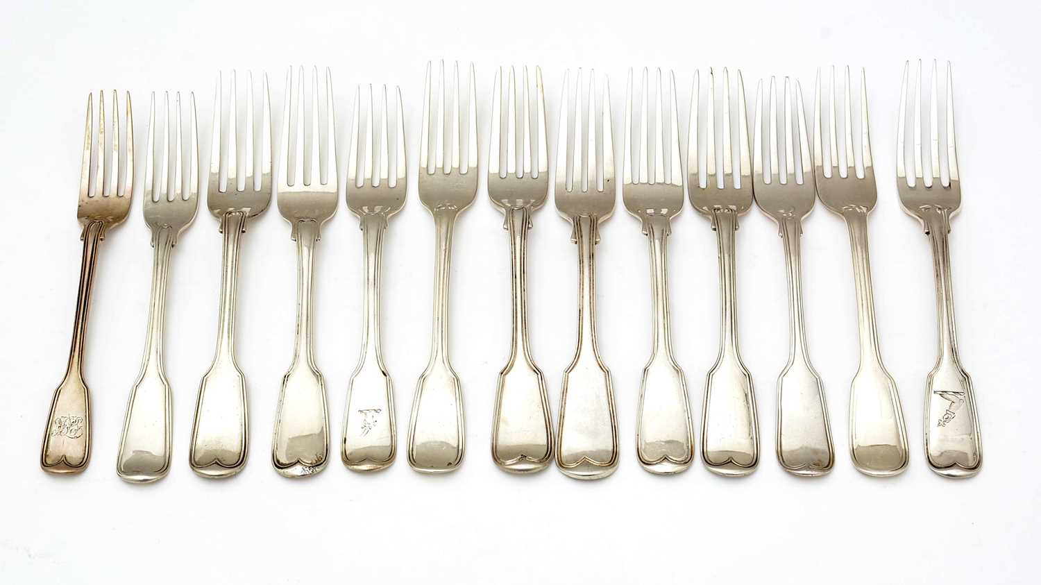 A selection of thirteen 19th Century silver dessert forks,