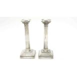 A pair of Edward VII silver candlesticks, by Hawksworth, Eyre & Co Ltd,