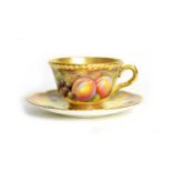 Fruit painted Worcester teacup and saucer