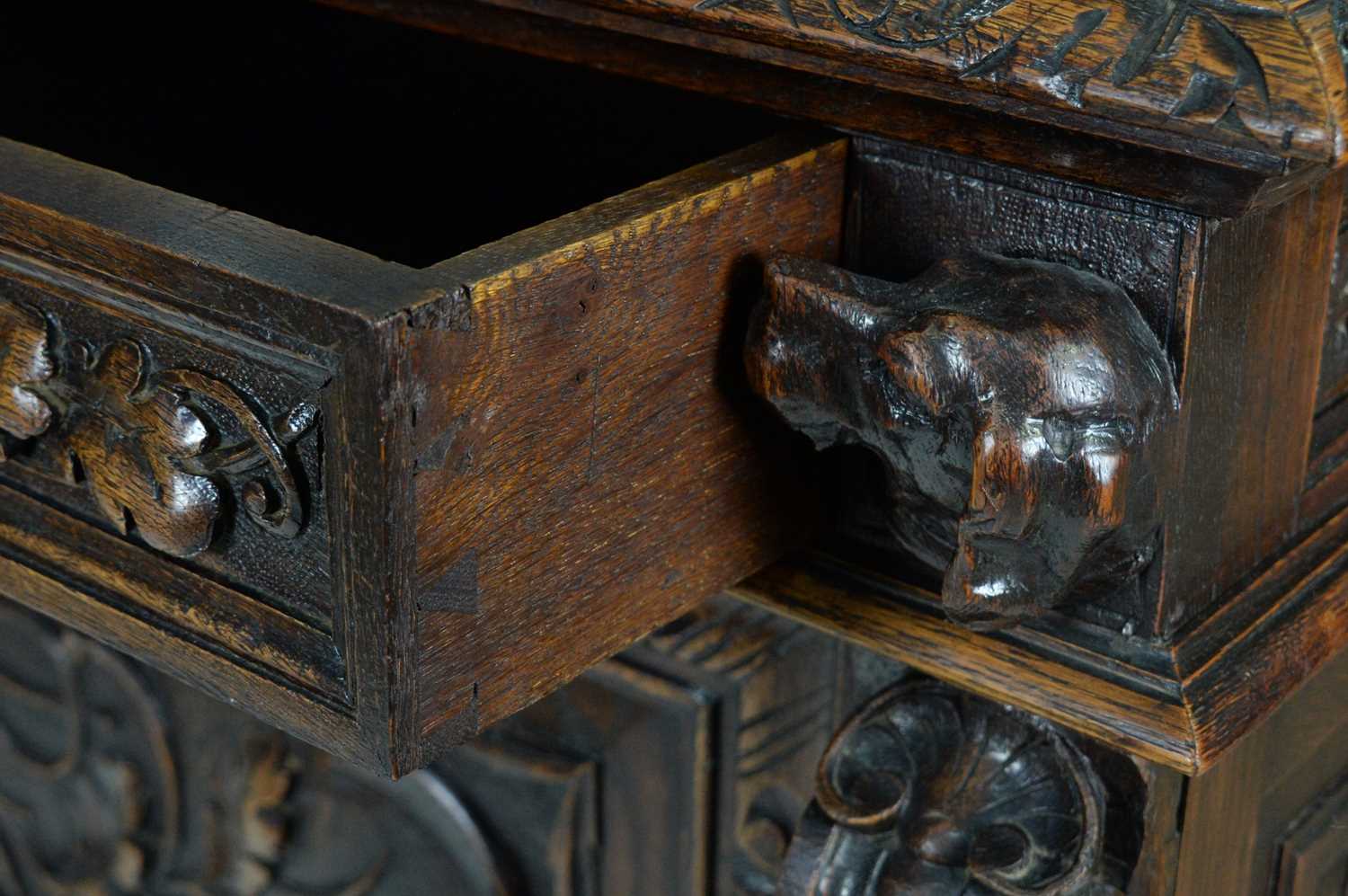 A richly carved Victorian oak side/pier cabinet with a sporting theme.