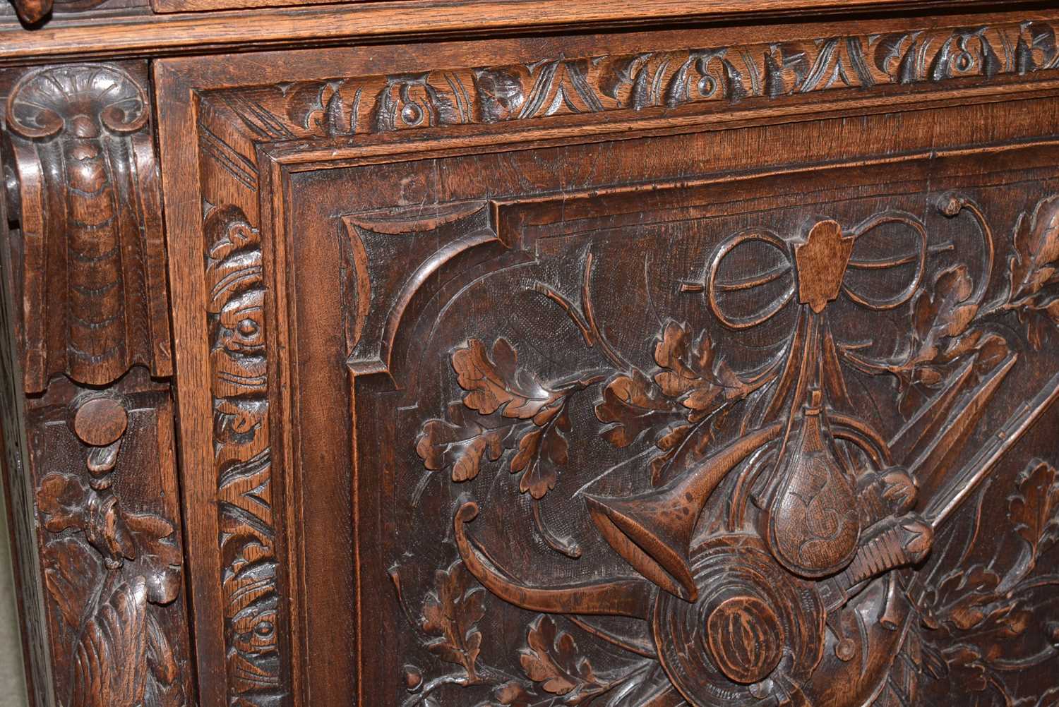 A richly carved Victorian oak side/pier cabinet with a sporting theme. - Image 9 of 37