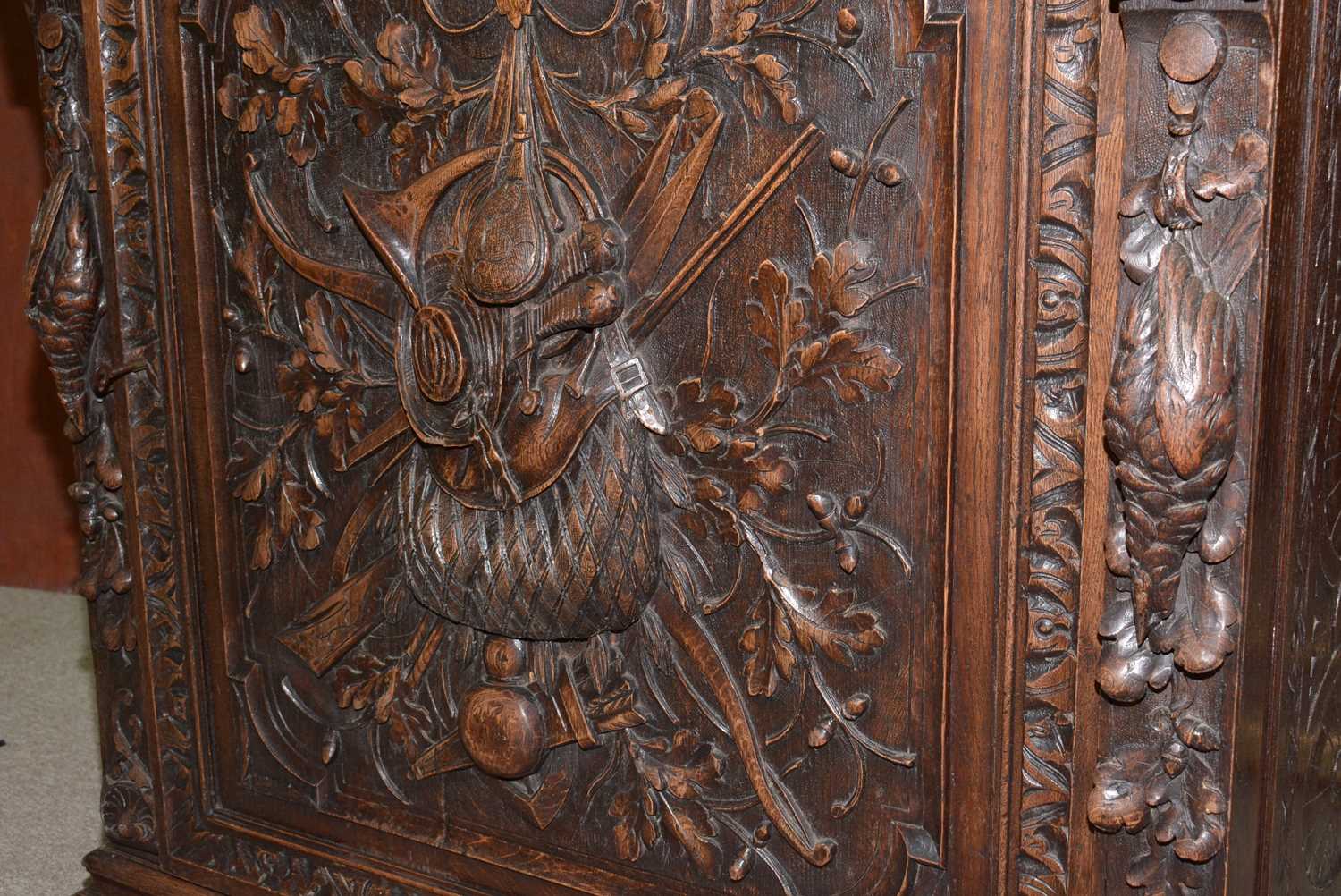 A richly carved Victorian oak side/pier cabinet with a sporting theme. - Image 33 of 37