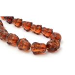 Amber Buddha head bead necklace