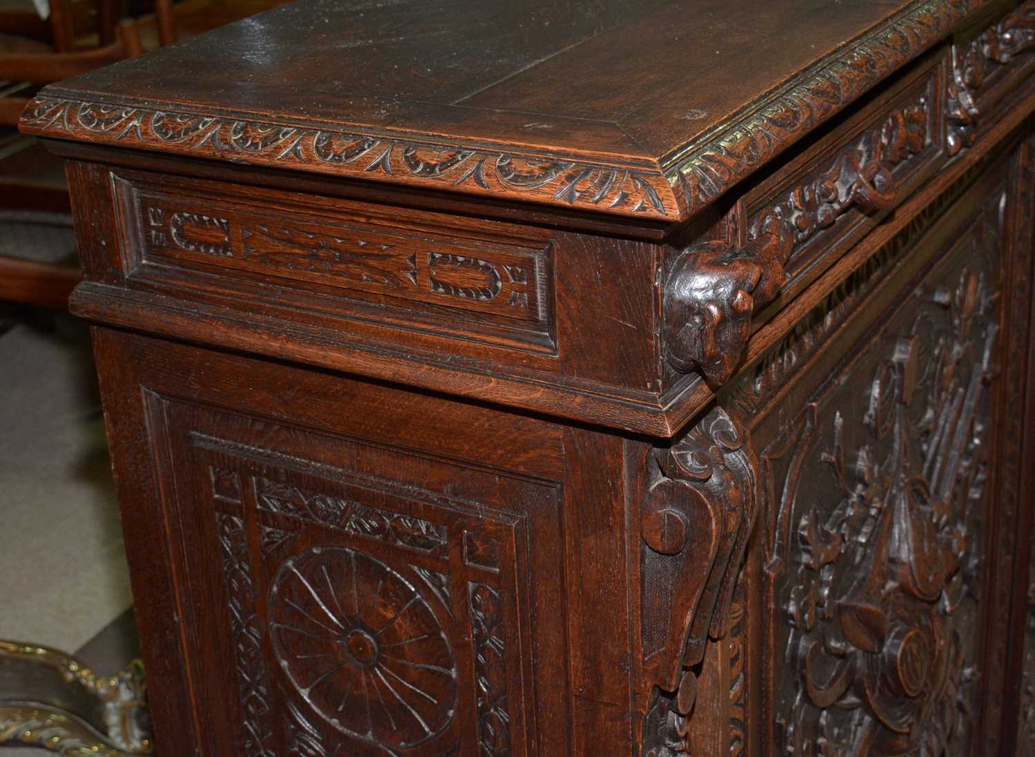 A richly carved Victorian oak side/pier cabinet with a sporting theme. - Image 7 of 37