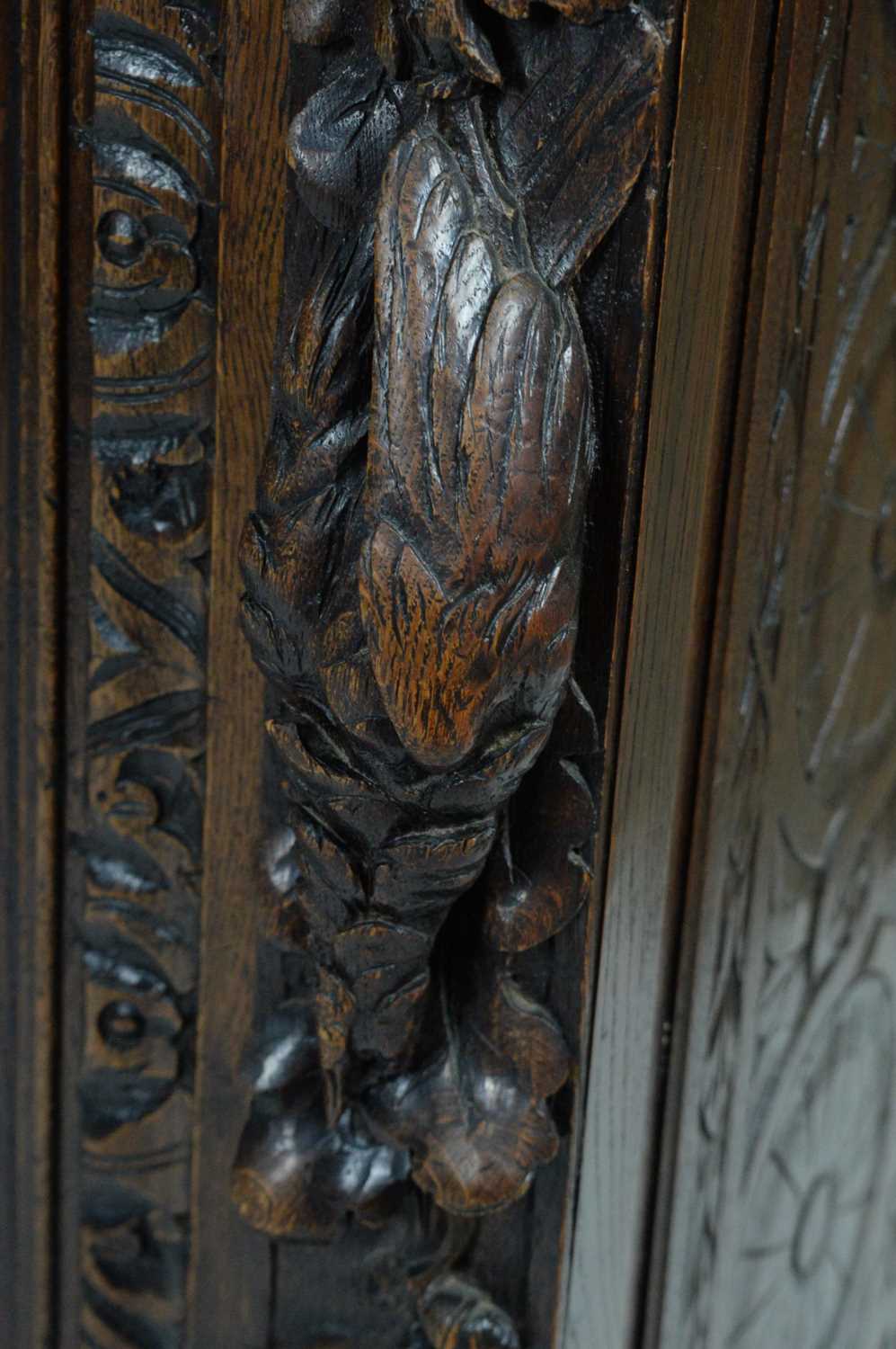 A richly carved Victorian oak side/pier cabinet with a sporting theme. - Image 23 of 37