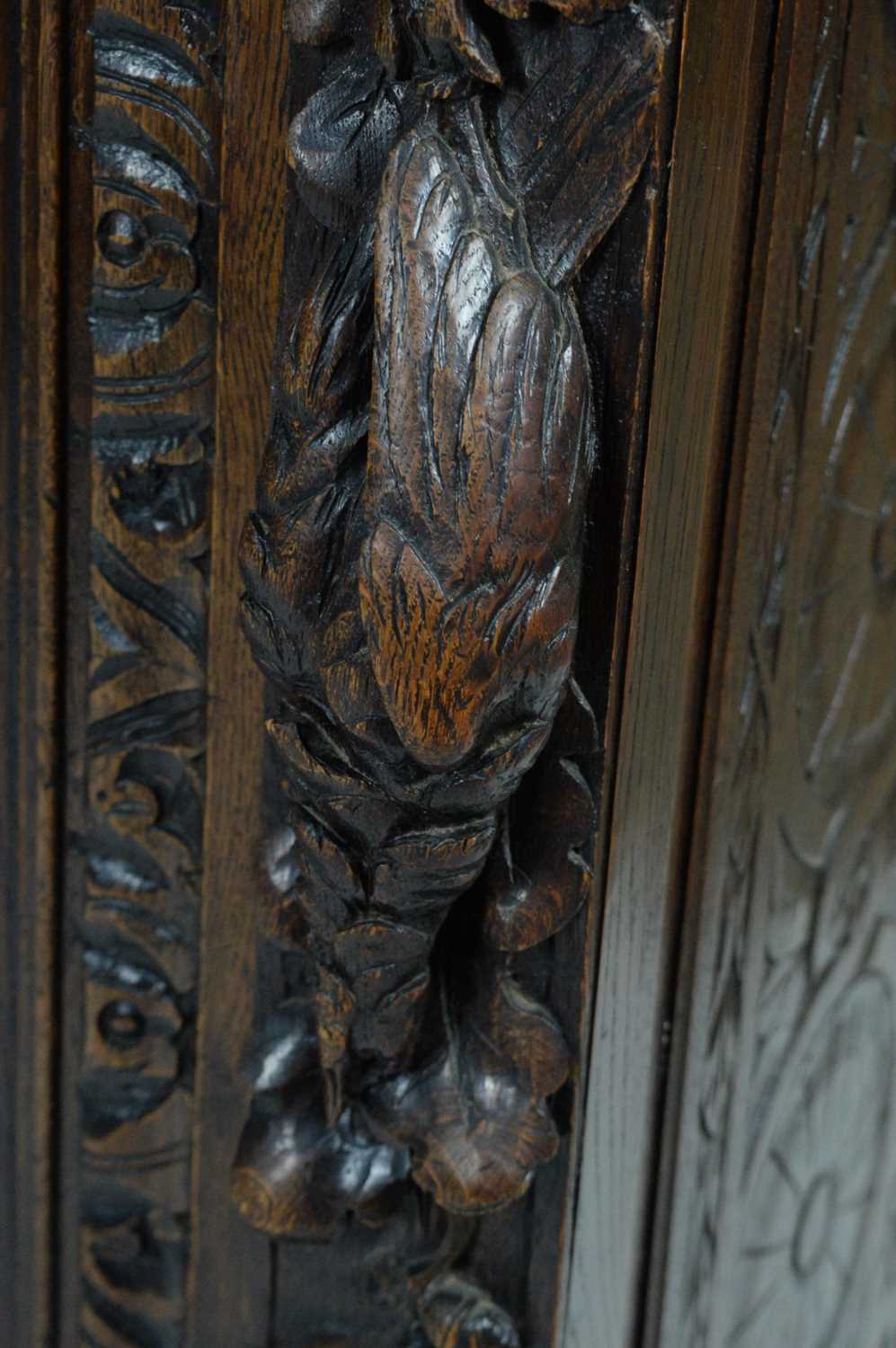 A richly carved Victorian oak side/pier cabinet with a sporting theme. - Image 2 of 37