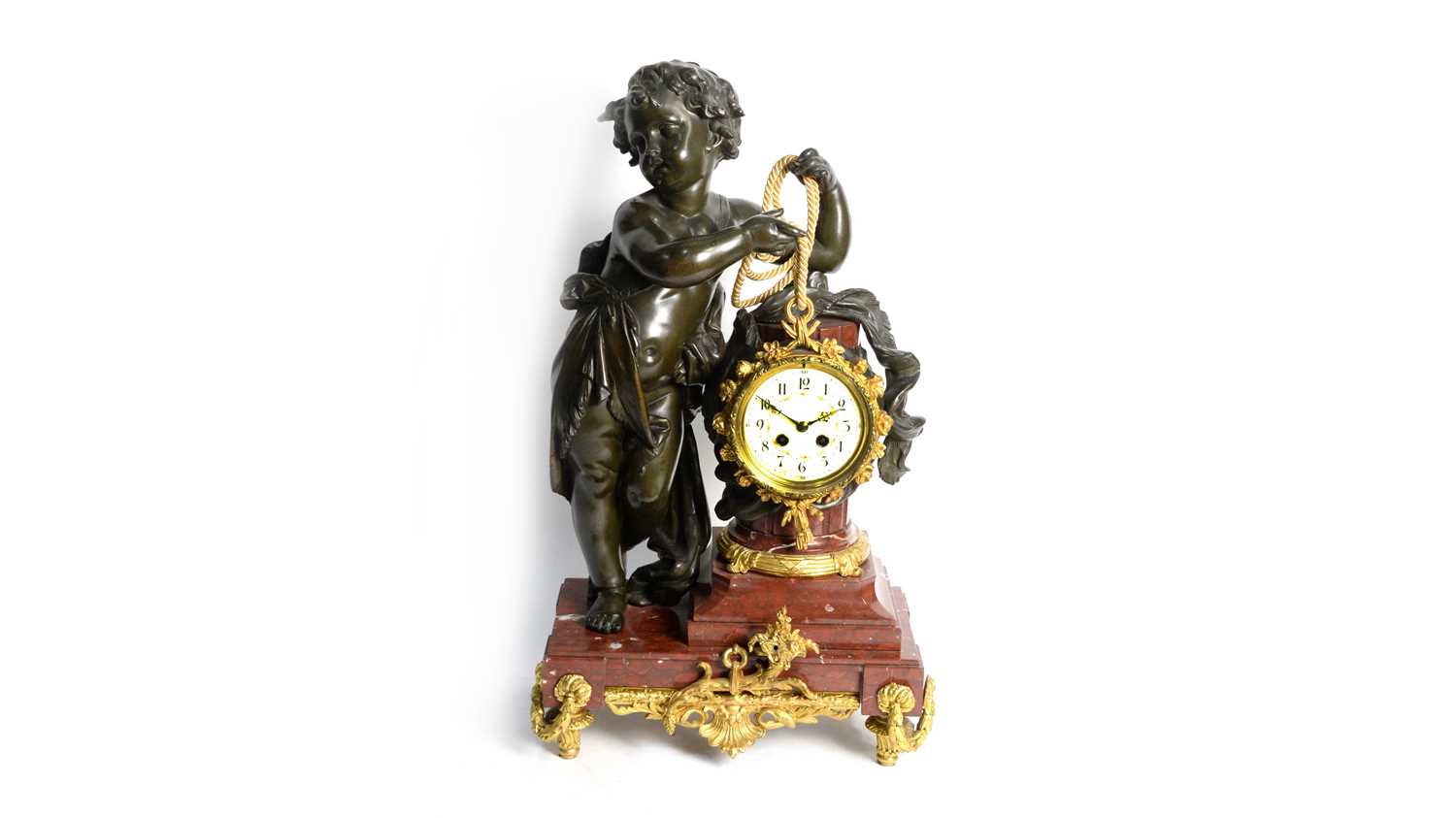 An ornate late 19th Century French bronzed spelter and gilt metal mantel clock