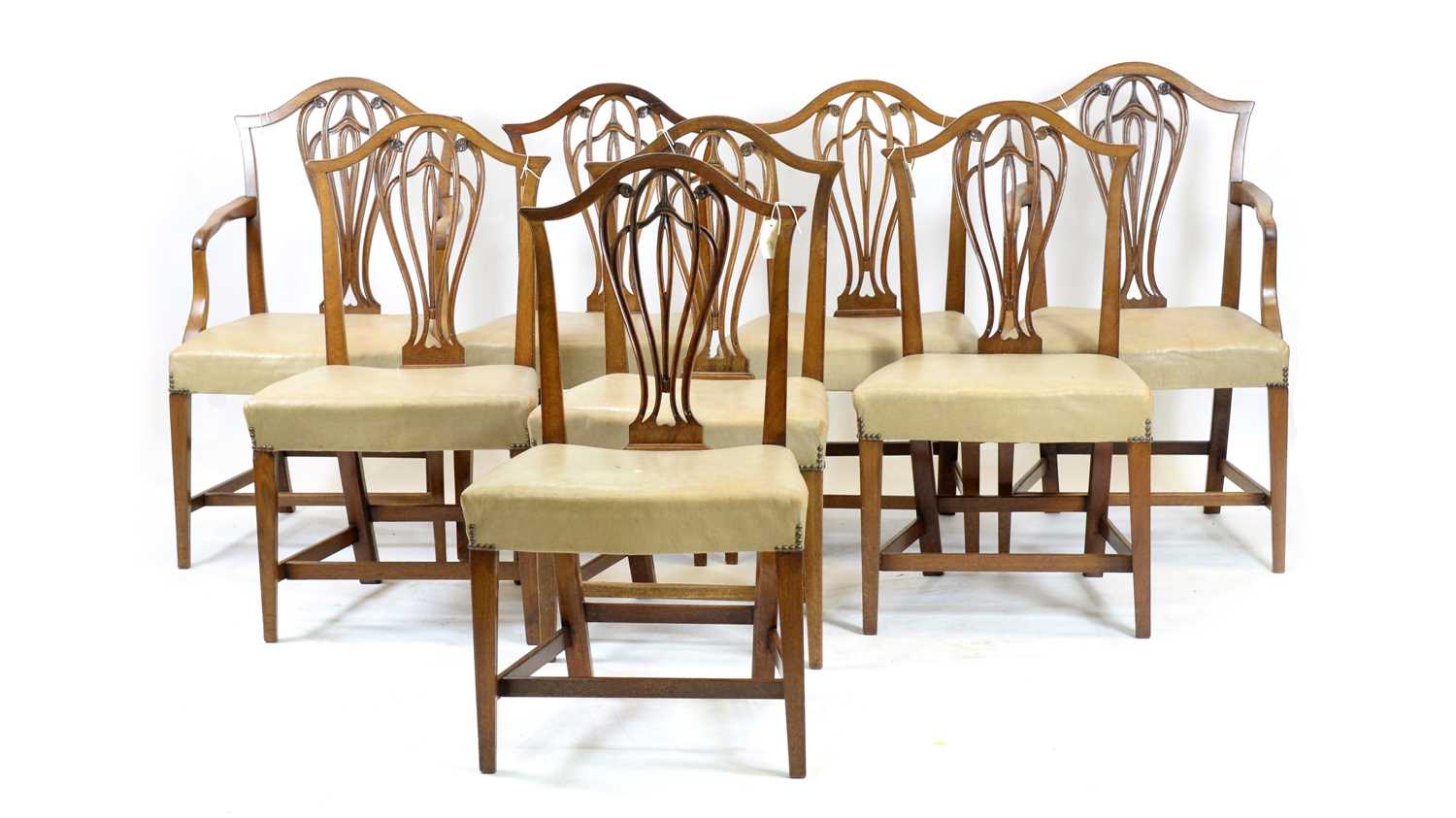 A near-matching set of eight George III mahogany dining chairs.