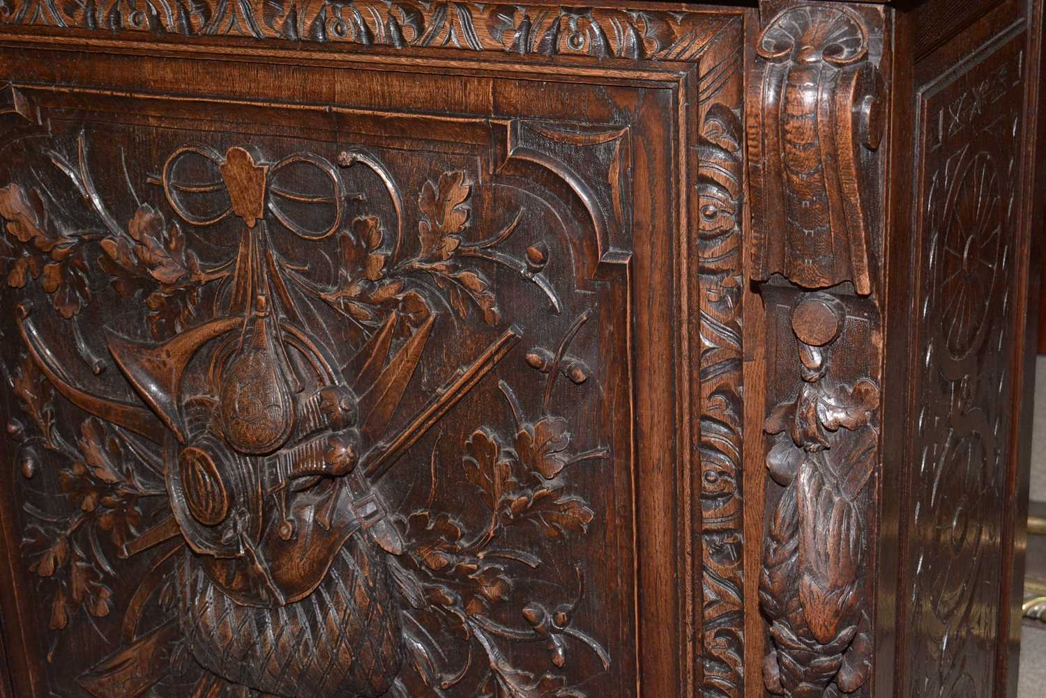 A richly carved Victorian oak side/pier cabinet with a sporting theme. - Image 13 of 37