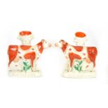 Pair of Staffordshire 'MILK SOLD HERE' cows