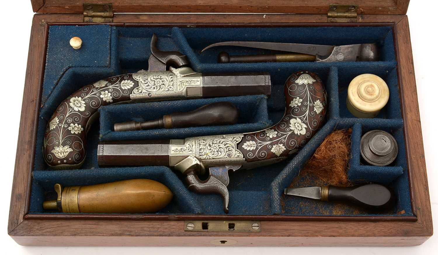 A cased pair of 19th Century percussion pistols, by Smith,