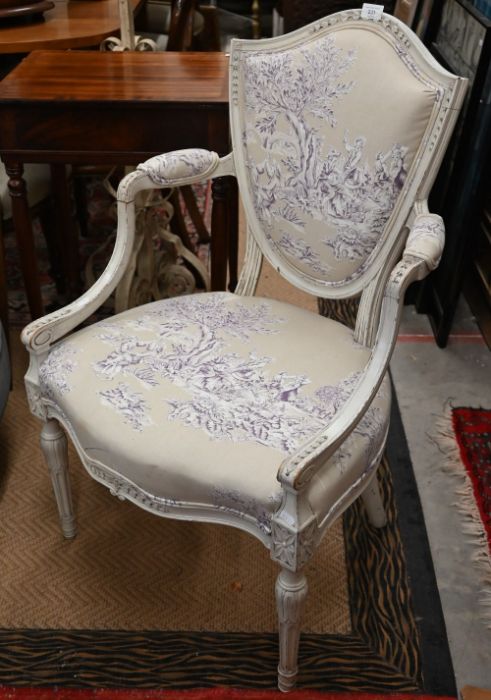 A French carved and cream painted shield back salon chair