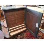 A 19th century oak twenty-drawer coin collector cabinet