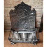 An antique cast iron fireback, a fire basket and coal scuttle (3)