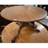A 19th century oak circular tilt-top table