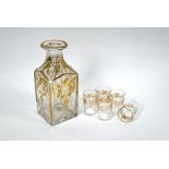 A 19th century square-cut decanter and matching shot glasses