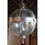 A large chrome framed and glazed in hanging globe electrolier