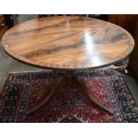 A reproduction cross-banded mahogany circular table