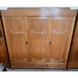 An early 20th century German Arts & Crafts light oak combination wardrobe